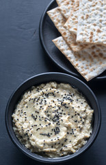 Bowl of baba ghanoush with matzo