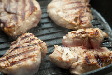 beef steak cooking over flaming grill