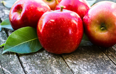 Red apples in wooden box. Copyspace