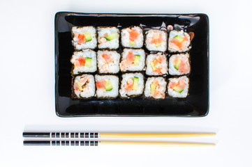 Sushi set on black clasic asian plate