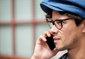 close up of man with smartphone calling on street