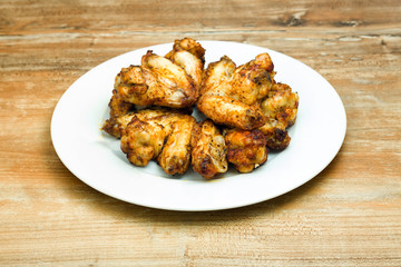 Plate of delicious barbecue chicken wings