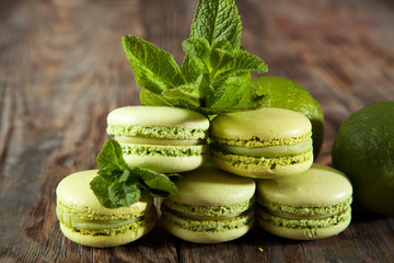 St Patricks Day green macarons with shamrock flags and leprechaun hat