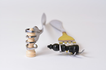 Who we are? / Chess pieces in the hands of forks