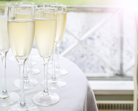 glasses with champagne stand on a table on the deck