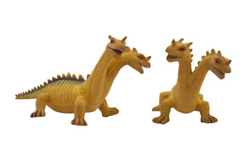 Naklejka premium Dragon toy photo. Isolated two-headed dragon toy full face and angle view photo.