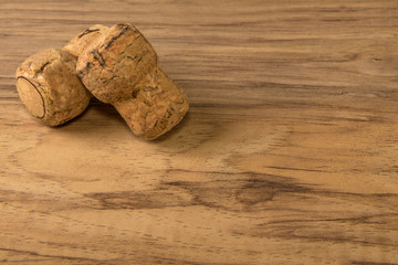 stoppers from champagne on a wooden background,