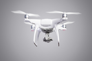 Flying helicopter drone with camera. Studio shot.