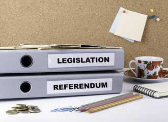 Legislation and Referendum - two folders on white office desk.