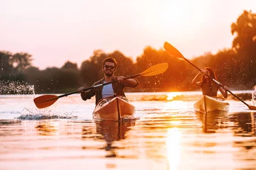 Foto op Canvas They love kayaking together.  © gstockstudio