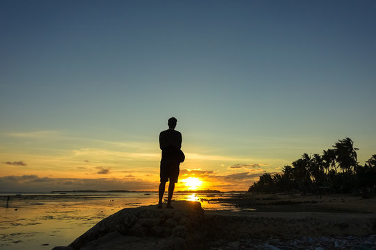 Solo Traveler Enjoying Sunset on Tropical Beach Vacation - Boracay, Philippines
