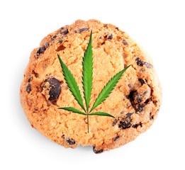 Tasty cookie with marijuana leaf on white background, closeup