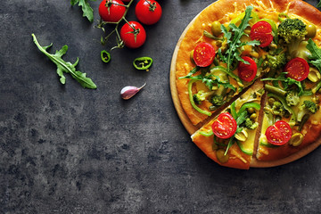 Plate with tasty vegetarian pizza on grey background