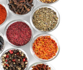 Various spices in glass bowls