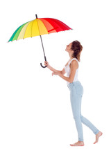 Pretty girl posing with color umbrella on white background