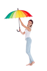 Pretty girl posing with color umbrella on white background