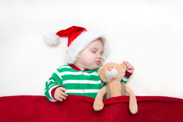 sleeping baby girl Santa Claus. Cute Baby - Christmas

