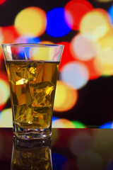 the refreshing juice with ice on a bright background