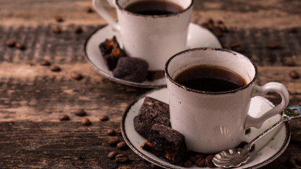 coffee cup with roasted  beans on wooden background