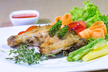 Grilled Chicken steak with sweet sauce, In white dish on the bro