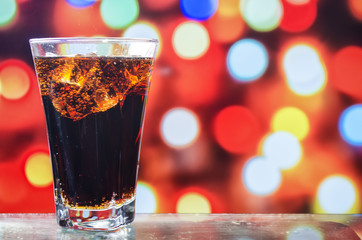 the refreshing juice with ice on a bright background