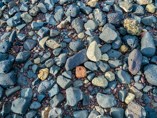 Various rocks, pebbles & stones background or texture