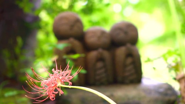 Cute stone monk statue Jizo Statue (Ksitigarbha)  is buddhist guardian of children soul in Japanese believe