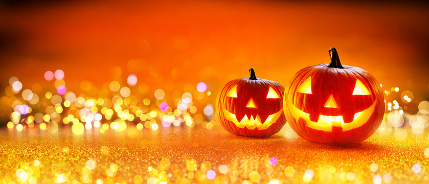 Halloween Pumpkin With Lights And Sparkle Bokeh Background
