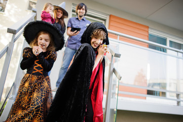 Trick or Treat. Two children in suits of evil forces have come to demand sweet.