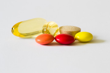 Pills on white background. Supplements, vitamins.