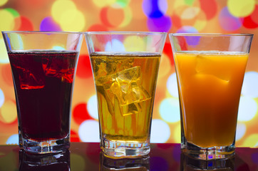 the refreshing juice with ice on a bright background