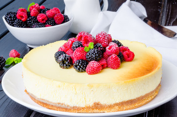 Delicious cheesecake with raspberries and blackberries