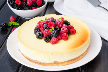 Delicious cheesecake with raspberries and blackberries
