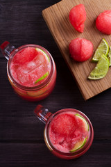 Watermelon cocktail with lime and cucumber. Healthy and detox drinks. View from above, top studio shot