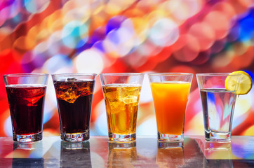 the refreshing juice with ice on a bright background