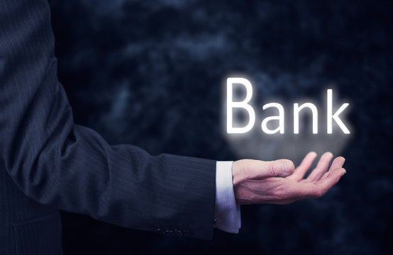 Businessman holding a Bank Concept