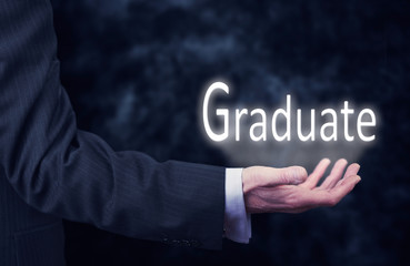 Businessman holding a Graduate Concept
