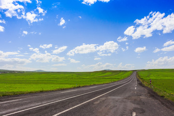 Highway. Open views and sunny weather to travel.
