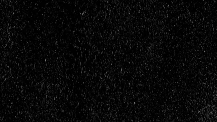 Fotobehang Falling raindrops footage animation in slow motion on black background, black and white luminance matte, rain animation with start and end, perfect for film, digital composition, projection mapping © railwayfx