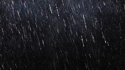 Foto op Canvas Falling raindrops footage animation in slow motion on dark black background with fog, lightened from top, rain animation with start and end, perfect for film, digital composition, projection mapping © railwayfx