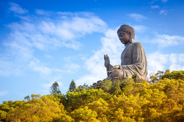 Buddha on the mountain in the autumn wood. China, Hong Kong