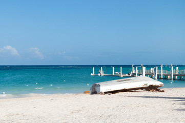 wooden fishing boat on sandy beach of Atlantic ocean
