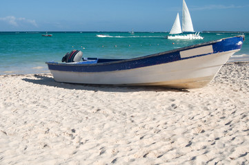 wooden fishing boat on sandy beach of Atlantic ocean