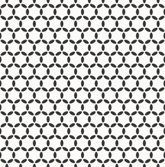 seamless monochrome circle grid pattern of ovals and dots.