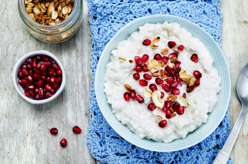 Coconut rice with pomegranate and granola