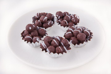 Chocolate ball on white dish