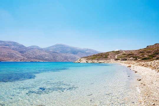 Greece, Cyclades, Amorgos, wooden dock and Aegean Sea in Nikouria island