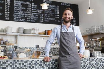 Smiling barista in a cafe