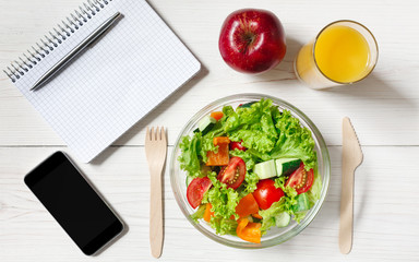 Healthy business lunch snack in office, vegetable salad top view