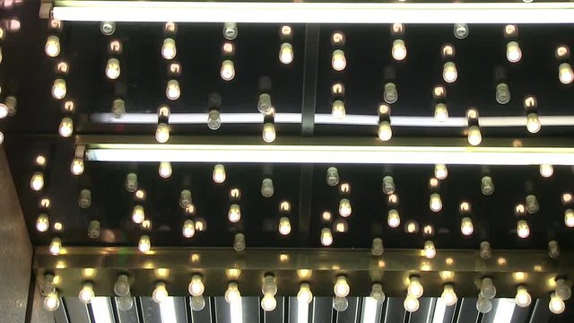 A close up of chasing vintage light bulbs on a marquee.